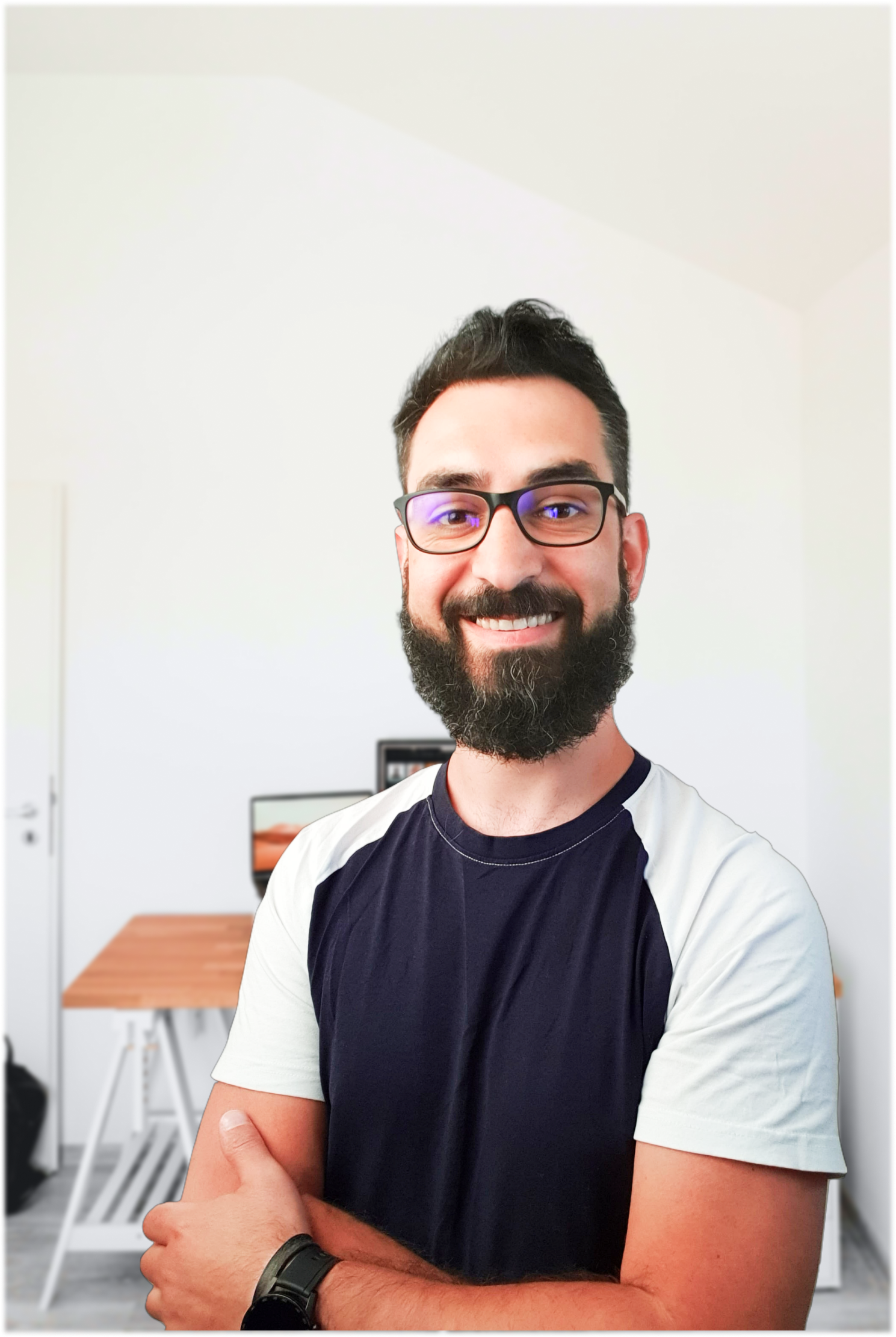 This is an image of John Toader in his office, smiling.